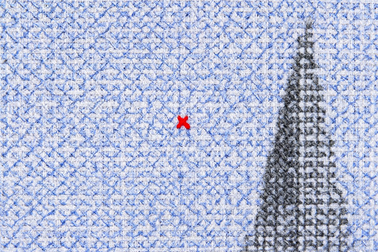 Beside the spire, one red stitch in all that blue.